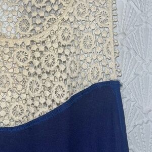 Assemetrical navy blue tank top.